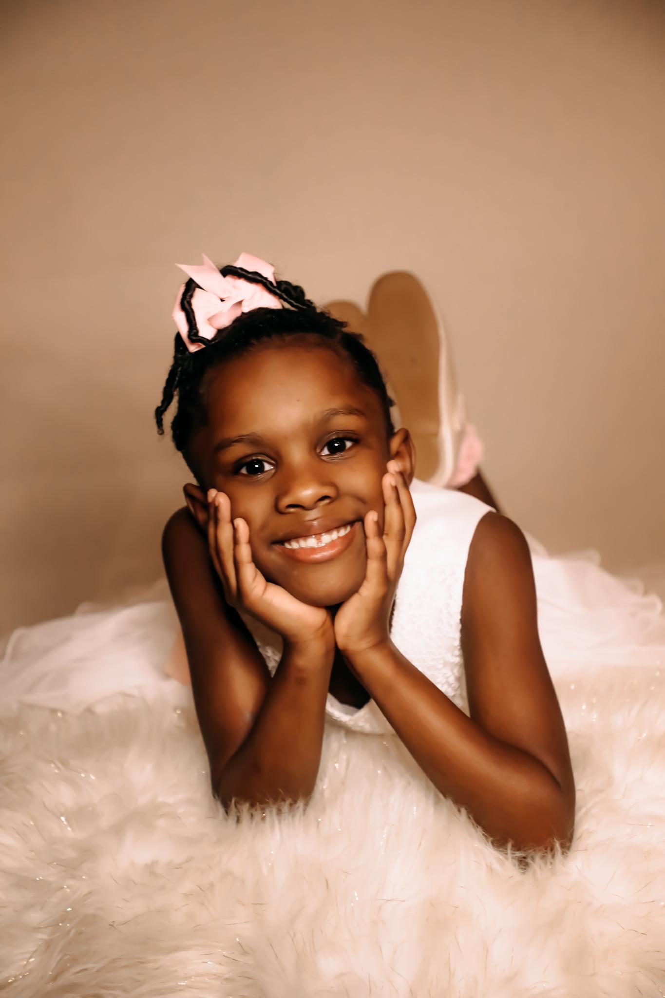 Ballerina in a pink tutu posed 