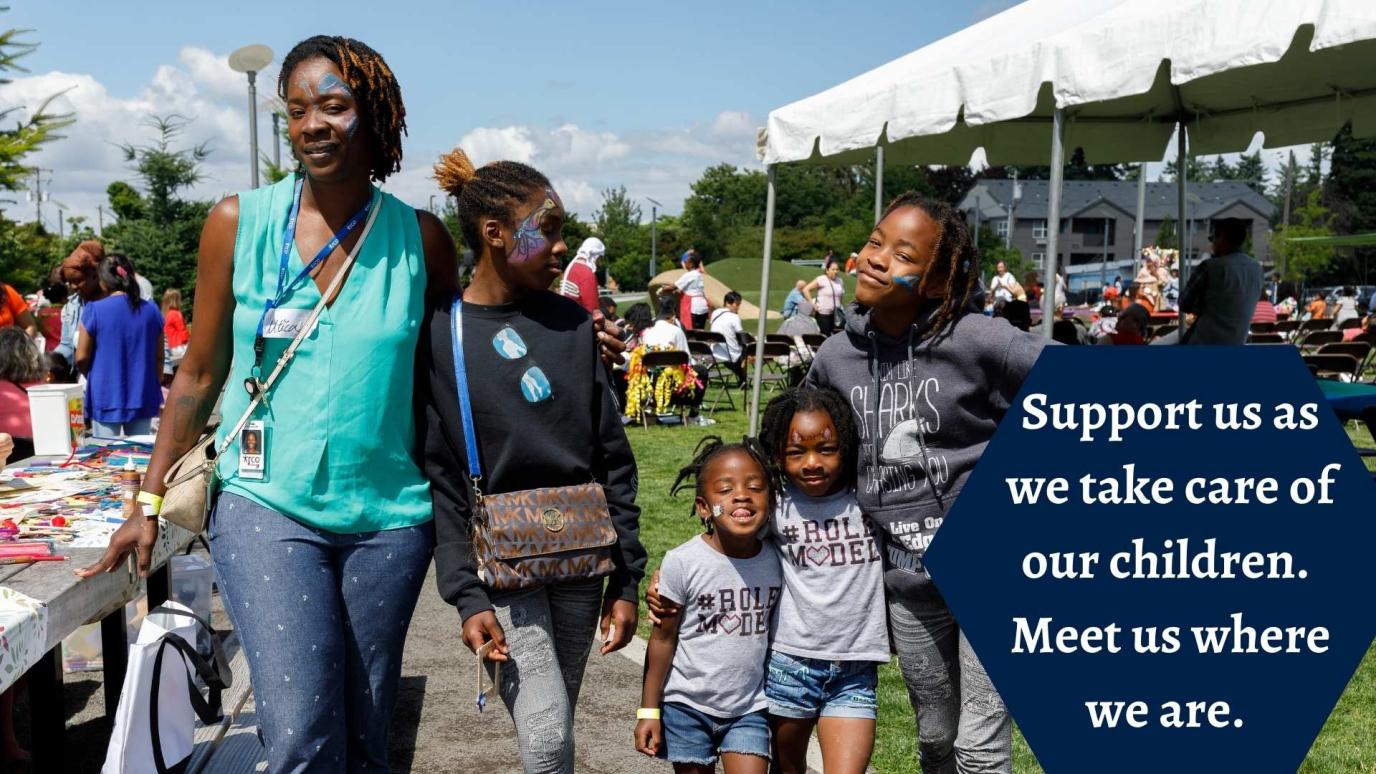 Family photo with face paintings and smiling during PAC Celebration