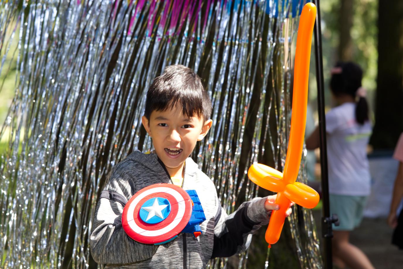 PAC Kid with balloon toys