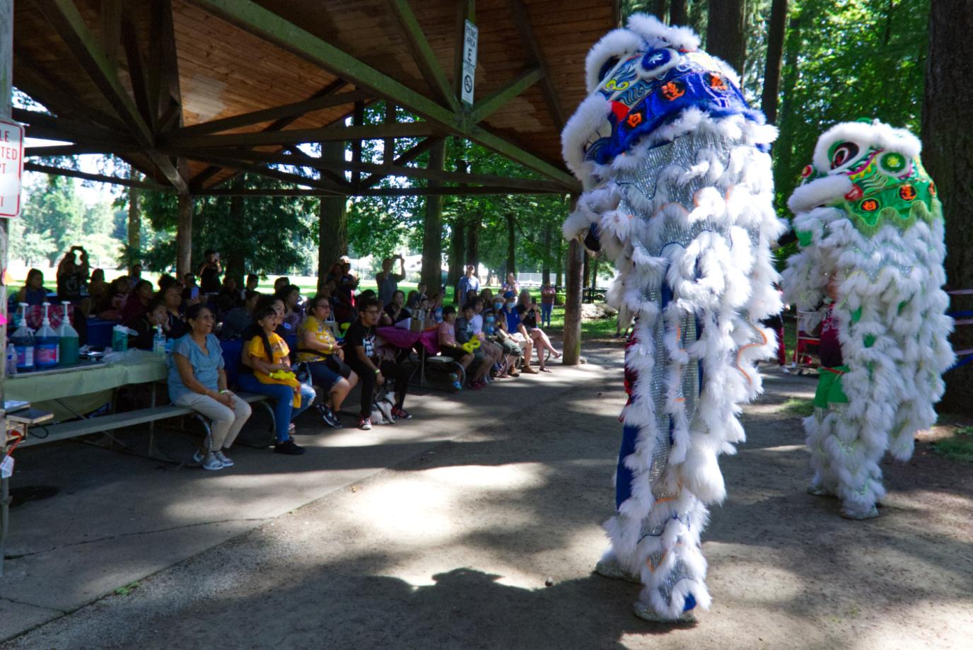 Lion dancers perform in front of crowd