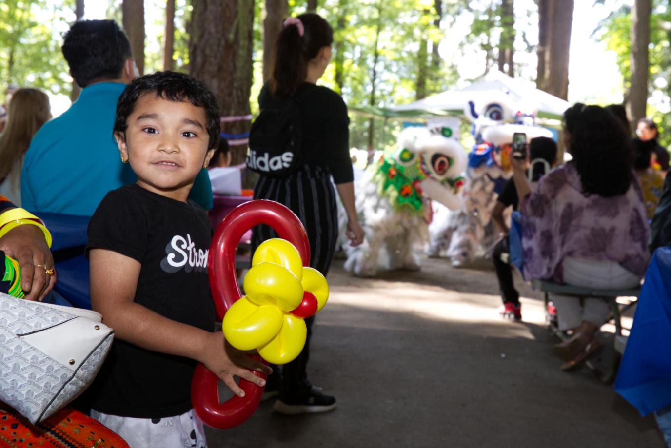 Kid with balloon during performance