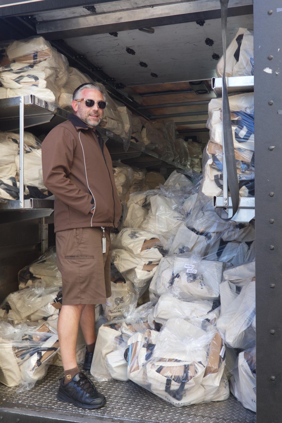 UPS delivery man with STEM boxes loaded