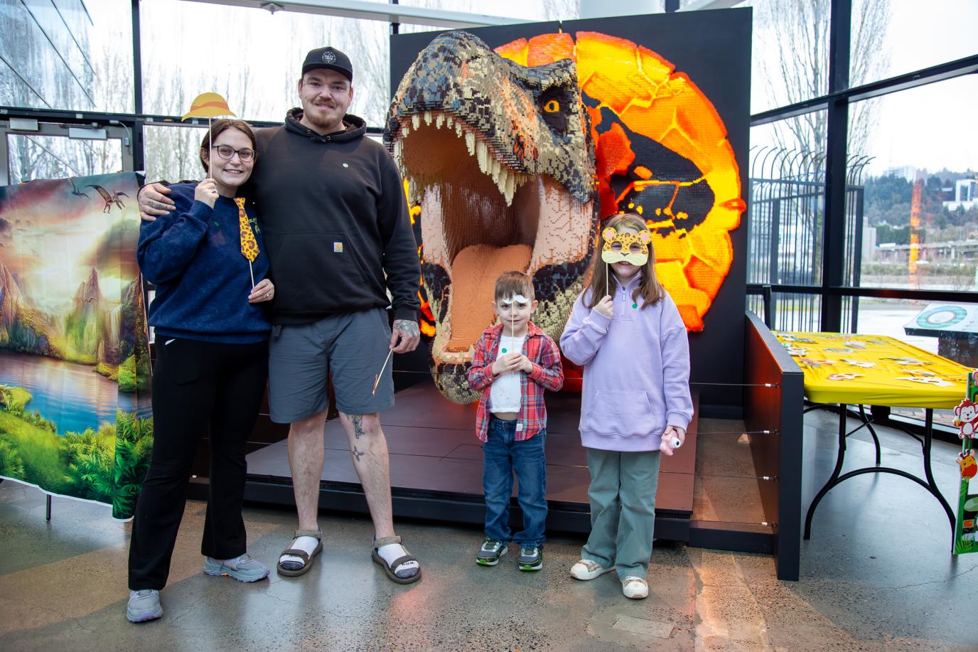 Family in front of Lego dinosaur at OMSI