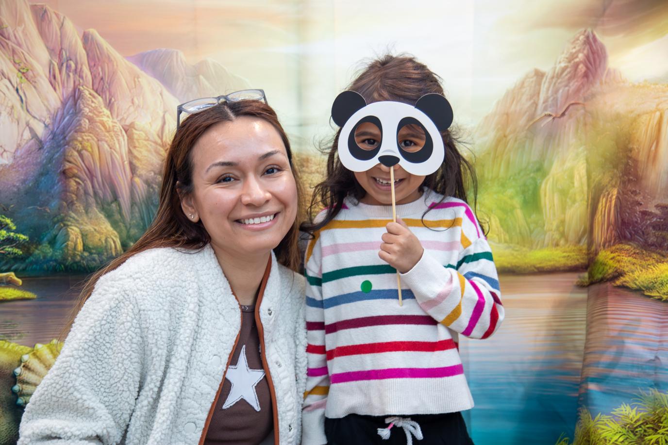 Woman and child with mask, at OMSI event