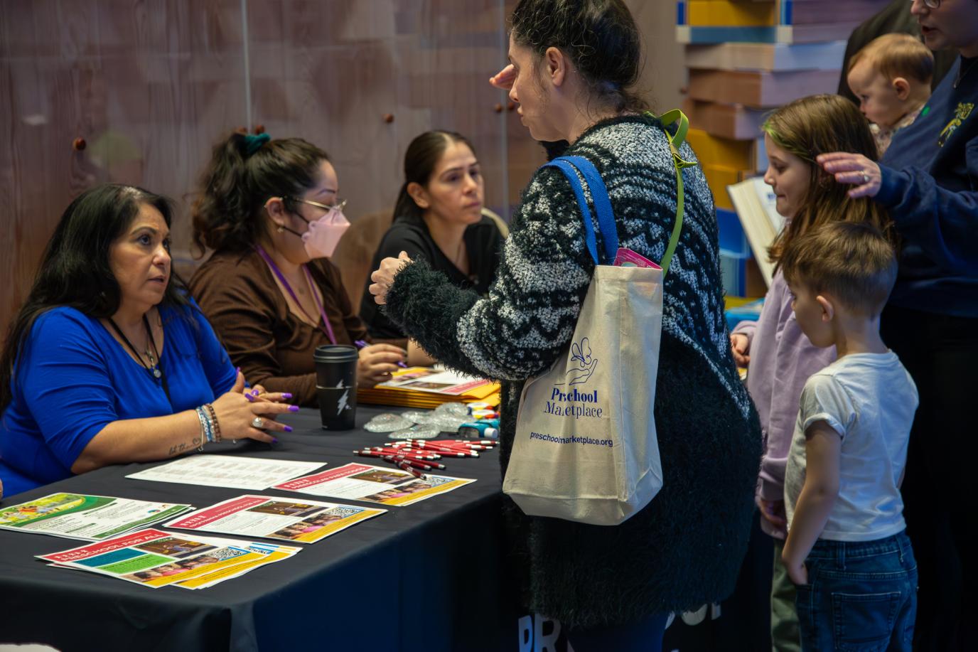 Families receiving information at OMSI event