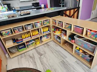 Shelves with educational toys are Learning Days Preschool