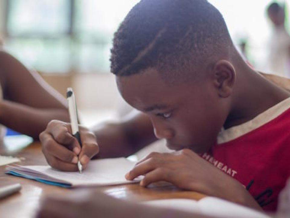 black boy studying at school