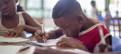 black boy studying at school