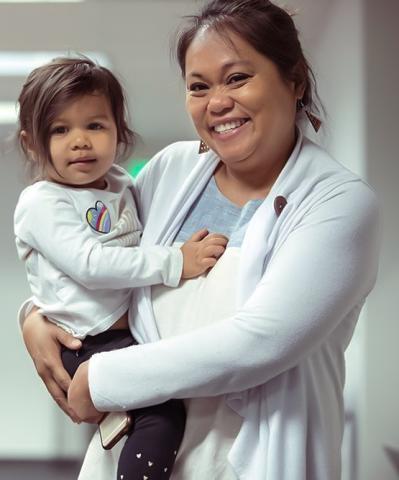 woman holding a preschool-age child