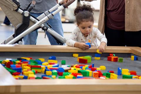 A child playing with educational toys at OMSI
