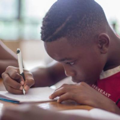 black boy studying at school