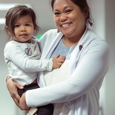 woman holding a preschool-age child