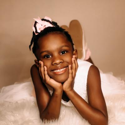 Ballerina in a pink tutu posed 