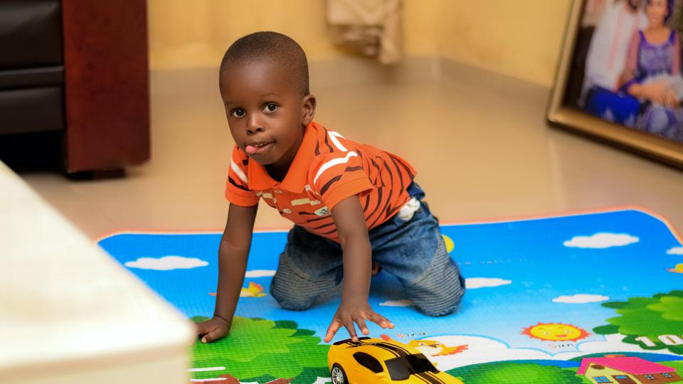 Child with toy car